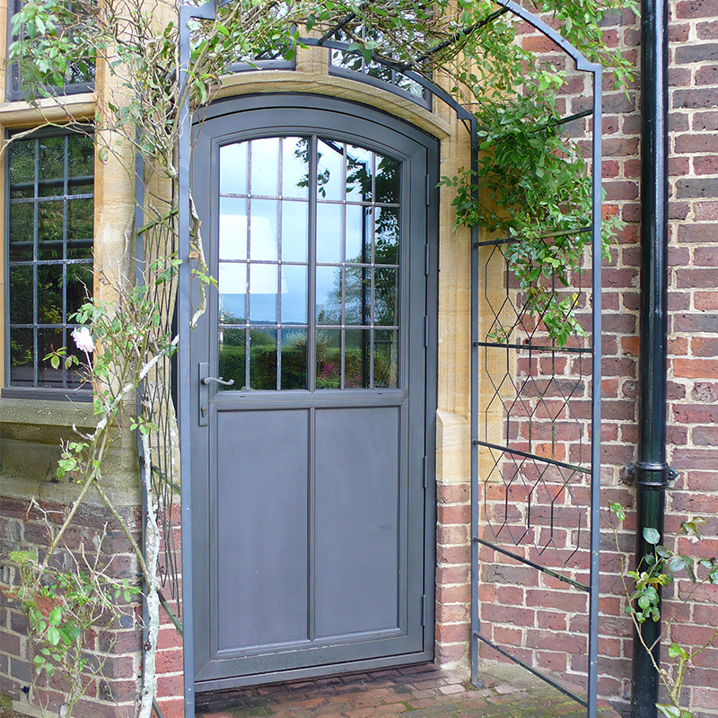 bronze door with arched top