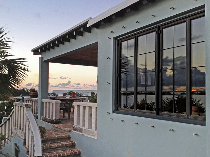 sunset over bronze windows and doors