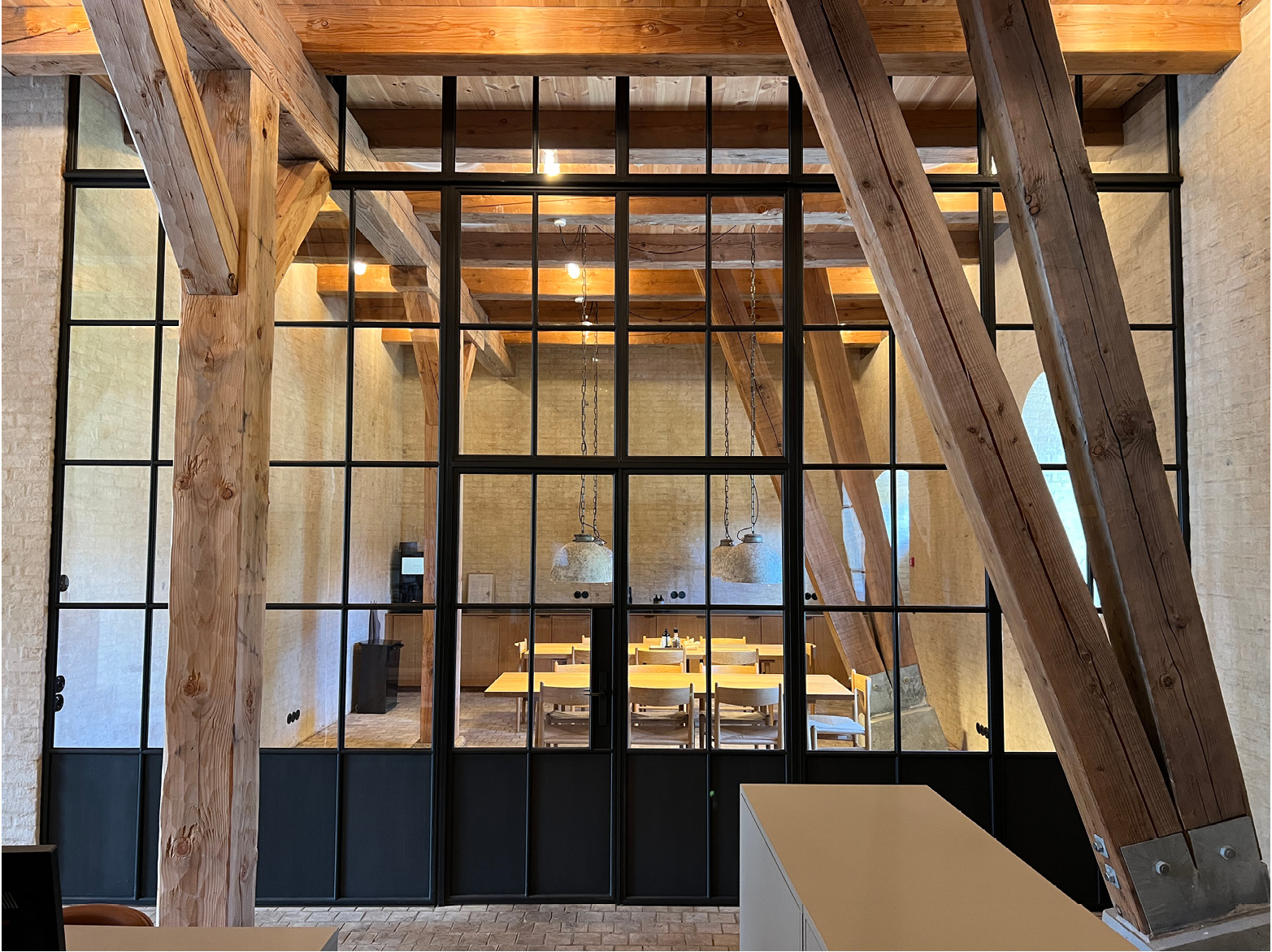 Bronze screen inside barn conversion