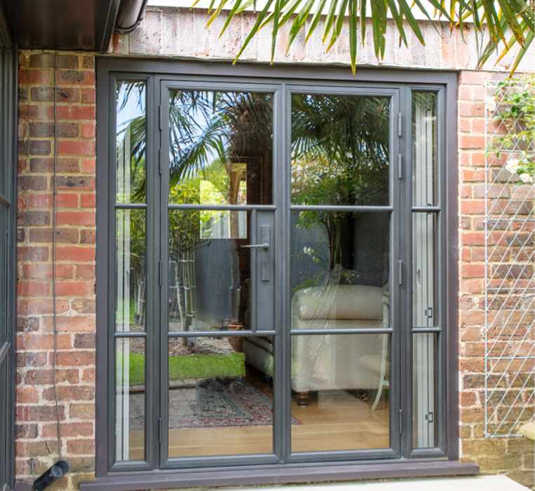 Bronze door with side windows