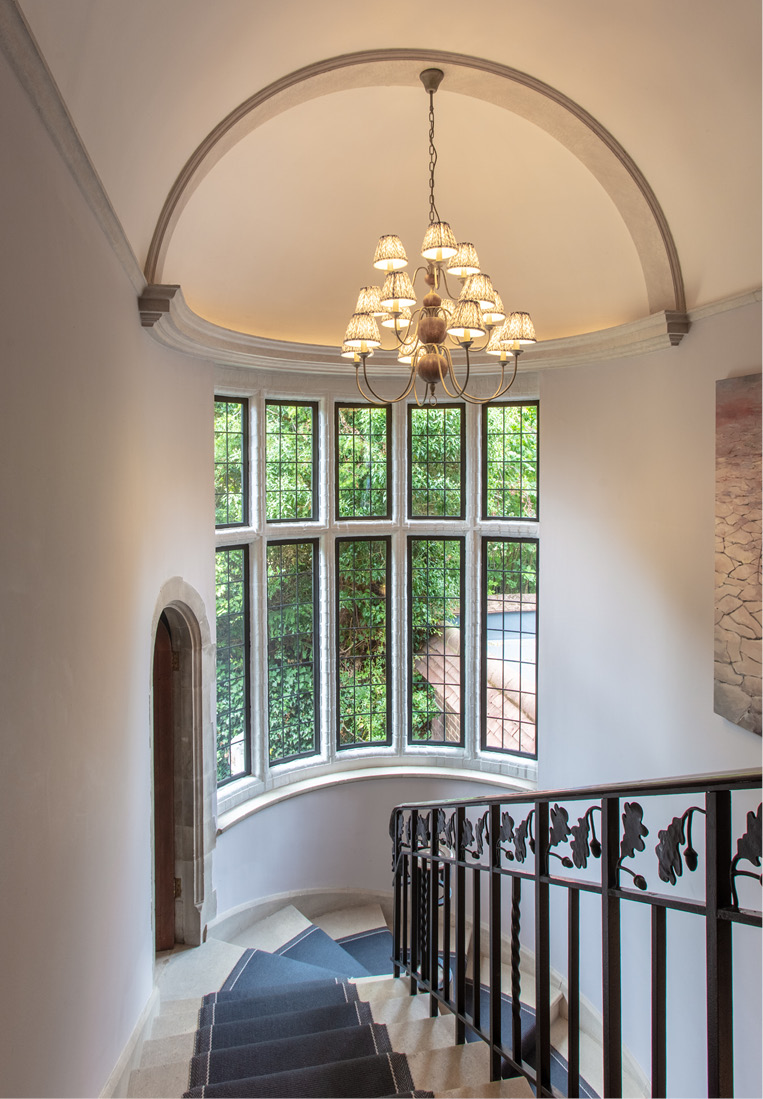 Stairwell with bowed windows