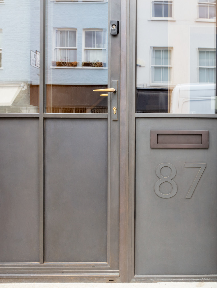 close up of bronze panel on door