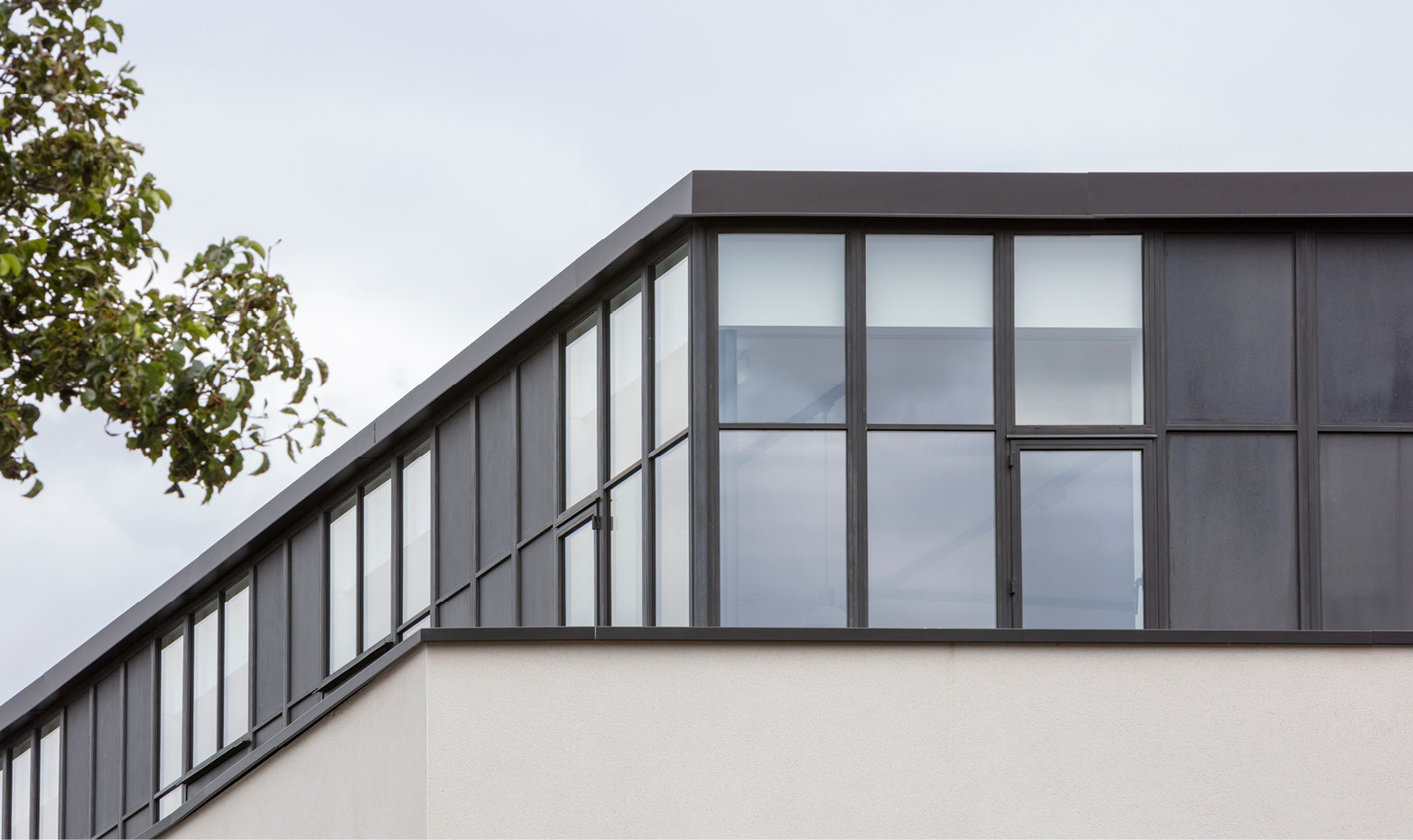 penthouse with bronze windows and panels