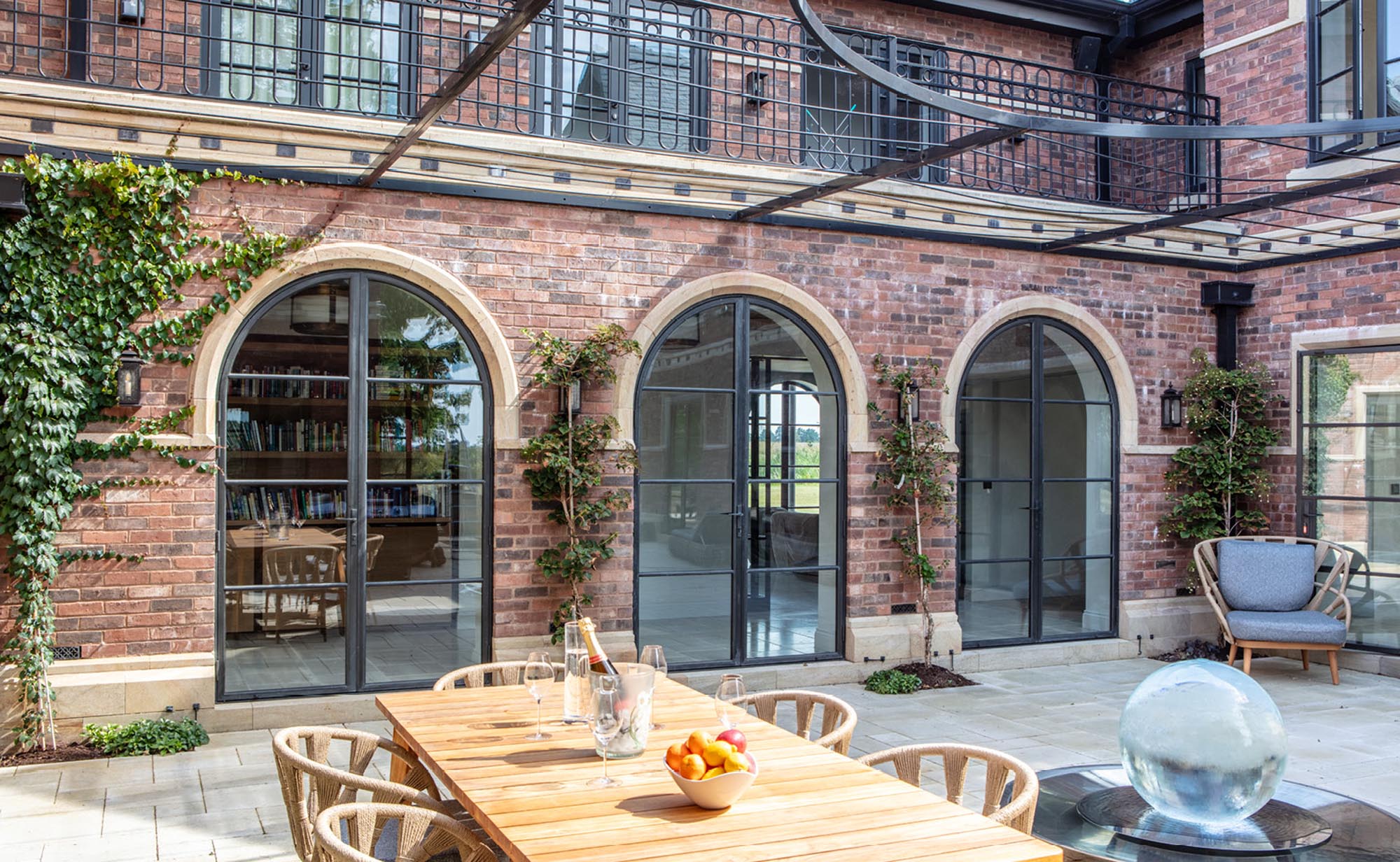 Courtyard with three bronze arched doors