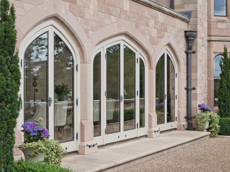 orangery extension with bronze doors in subframes