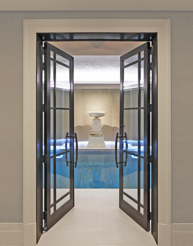 Margin design bronze door leading into swiming pool